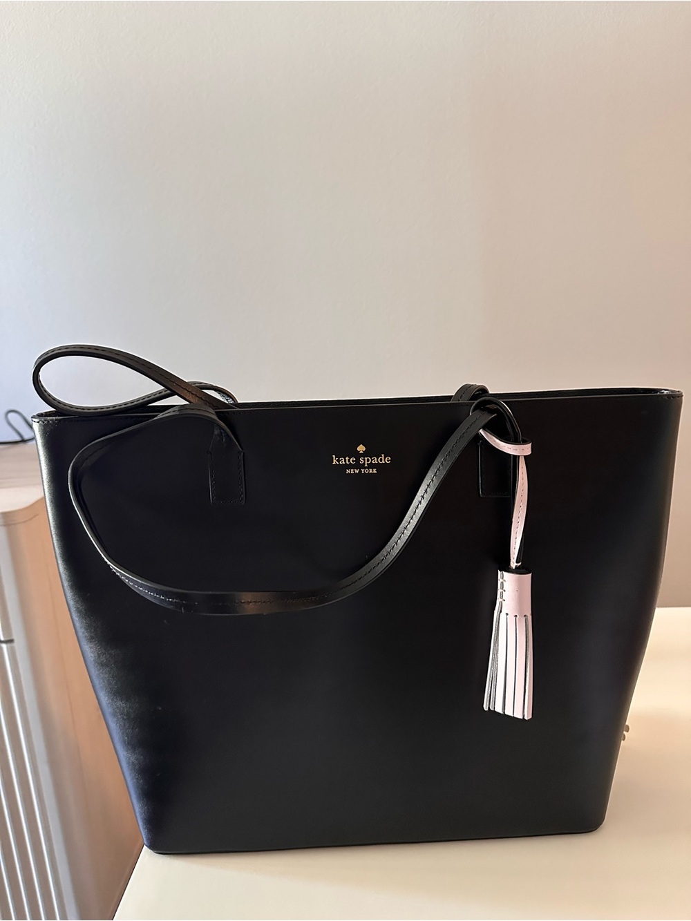 kate spade Structured Black Leather Tote with  a Tassel Charm (like new)